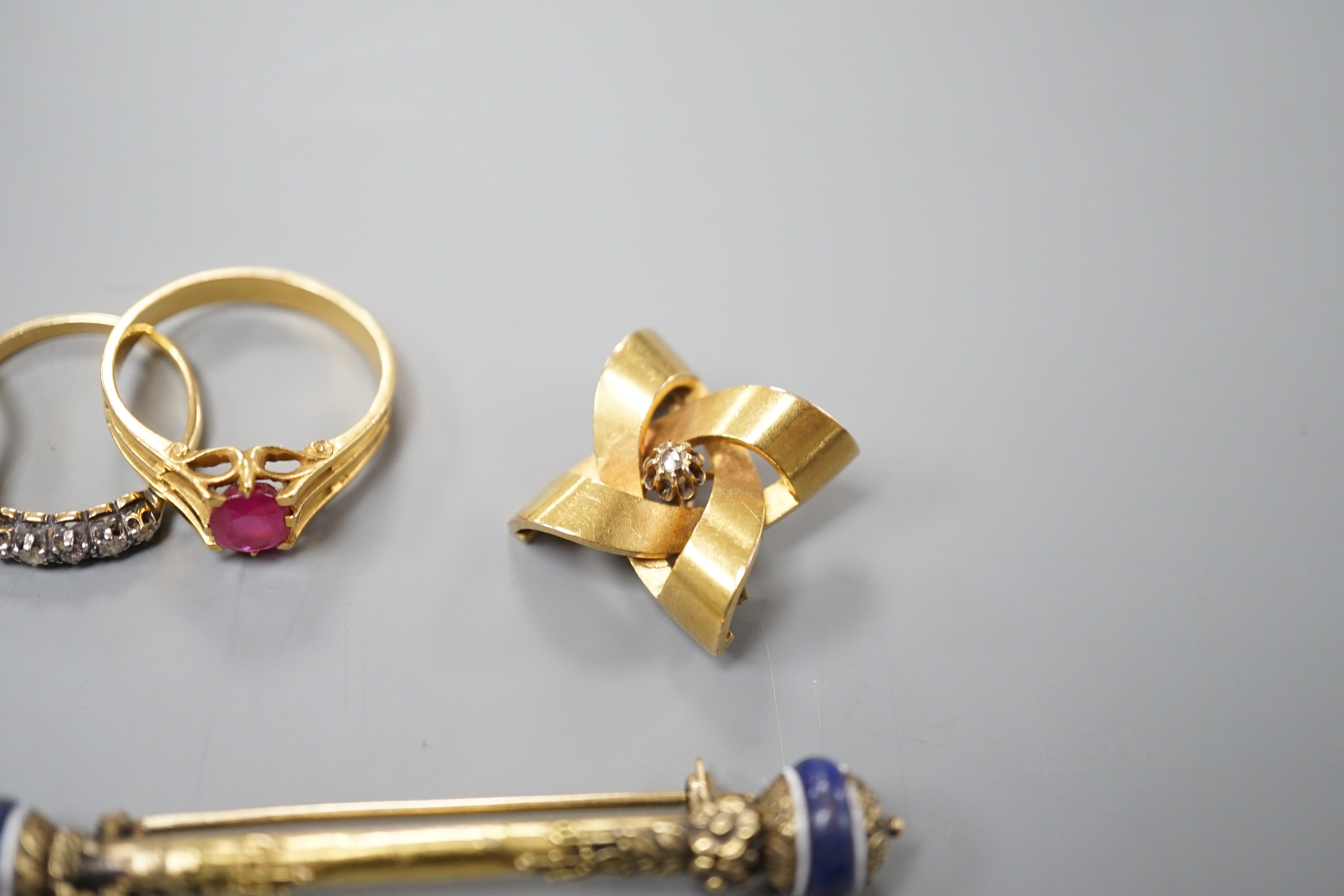 A group of mixed jewellery including two 18ct and diamond half hoop rings, a pair of Middle Eastern yellow metal and talismanic carnelian intaglio cufflinks, a yellow metal and diamond set brooch, a synthetic? ruby set y